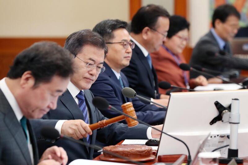 epa06718218 A handout photo made available by Cheong Wa Dae (the South Korean presidential office) shows South Korean President Moon Jae-in (2-L) chairing a cabinet meeting at the presidential office Cheong Wa Dae (or Blue House) in Seoul, South Korea 08 May 2018. Moon marks his first year in office on 10 May. According to media reports, he told ministers not to lose their resolve set at the start of the administration and urged the parliament to approve an extra budget as soon as possible.  EPA/CHEONG WA DAE / HANDOUT SOUTH KOREA OUT HANDOUT EDITORIAL USE ONLY/NO SALES