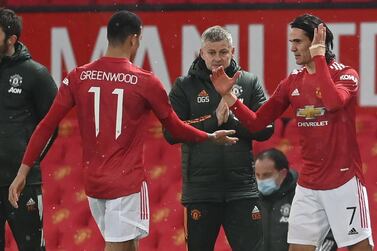 Manchester United manager Ole Gunnar Solskjaer, centre, will be without Edinson Cavani, right, and other first team players for the Europa League match against Real Sociedad but Mason Greenwood, left and who recently signed a new contract, will be aiming ti impress. AFP