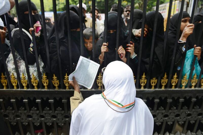 An Indian Muslim pilgrim bids farewell to relatives at Haj House in Hyderabad on Thursday, ahead of departing for Saudi Arabia on the Haj pilgrimage. Global health authorities have warned that pilgrims from across the world could spread the Mers virus as they travel to Saudi Arabia and then back to their home countries. Noah Seelam / AFP 

