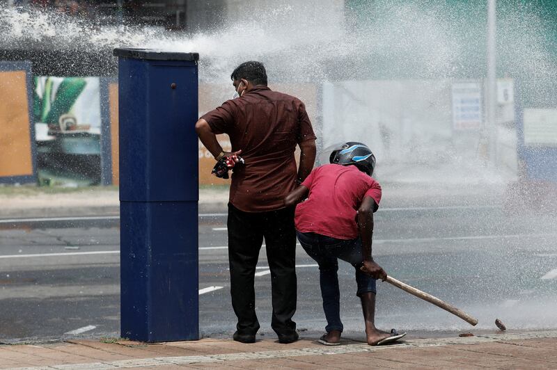 Water cannon are fired during a confrontation with anti-government demonstrators. Reuters