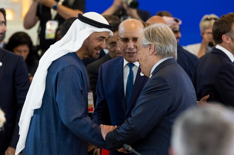 Sheikh Mohamed greets Mr Guterres. Photo: Ryan Carter / UAE Presidential Court 