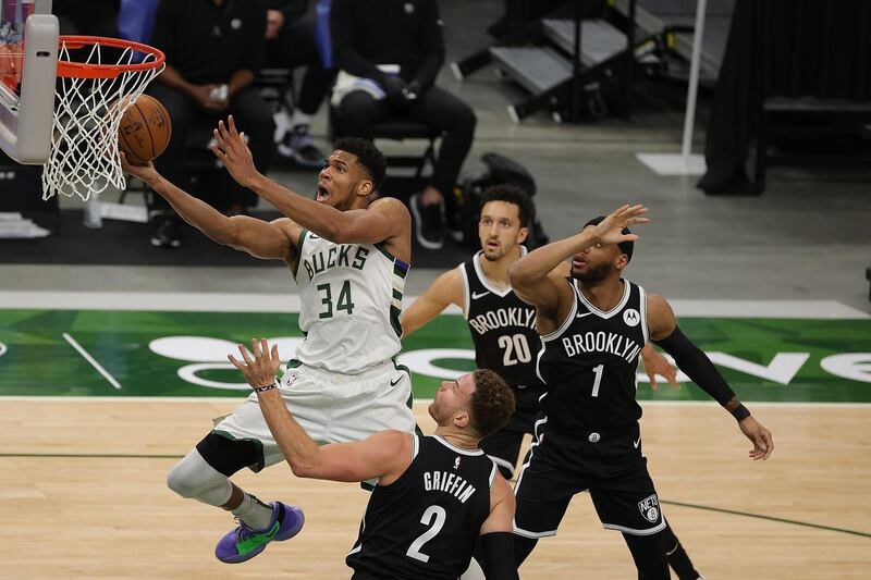 MILWAUKEE, WISCONSIN - MAY 04: Giannis Antetokounmpo #34 of the Milwaukee Bucks drives to the basket against Blake Griffin #2 of the Brooklyn Nets during the second half of a game at Fiserv Forum on May 04, 2021 in Milwaukee, Wisconsin. NOTE TO USER: User expressly acknowledges and agrees that, by downloading and or using this photograph, User is consenting to the terms and conditions of the Getty Images License Agreement.   Stacy Revere/Getty Images/AFP
== FOR NEWSPAPERS, INTERNET, TELCOS & TELEVISION USE ONLY ==
