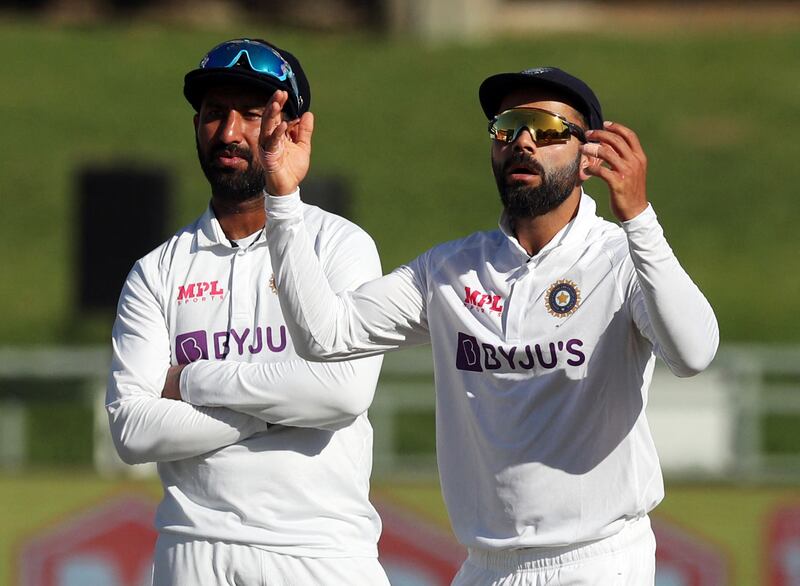 Kohli and Cheteshwar Pujara during the third Test against South Africa. Reuters