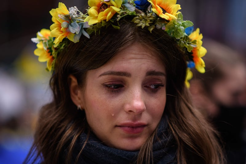 A protester weeps as she takes part in a 'mothers' march' for Ukraine, in New York. AFP