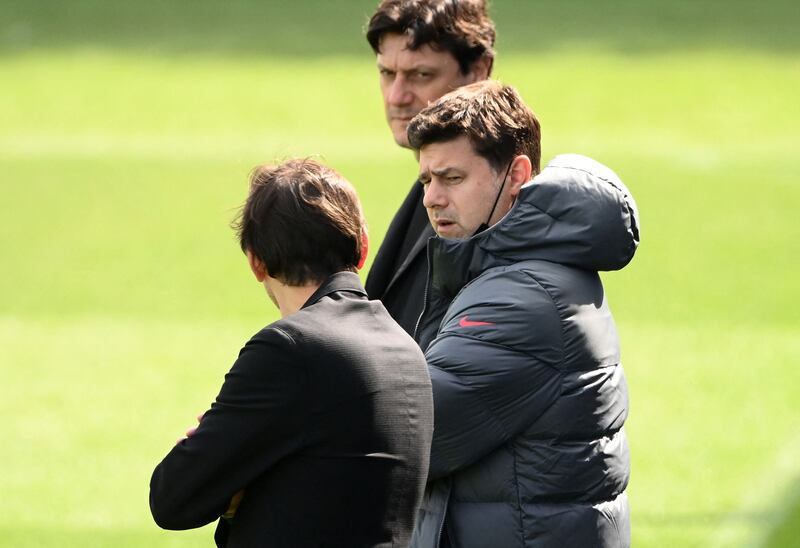 PSG manager Mauricio Pochettino speaks with sporting director Leonardo. AFP
