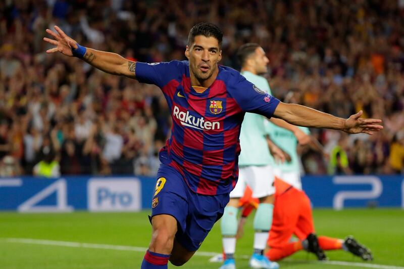 Barcelona's Luis Suarez celebrates after scoring his side's second goal during the group F Champions League soccer match between F.C. Barcelona and Inter Milan at the Camp Nou stadium in Barcelona, Spain, Wednesday, Oct. 2, 2019. Barcelona won 2-1. (AP Photo/Emilio Morenatti)