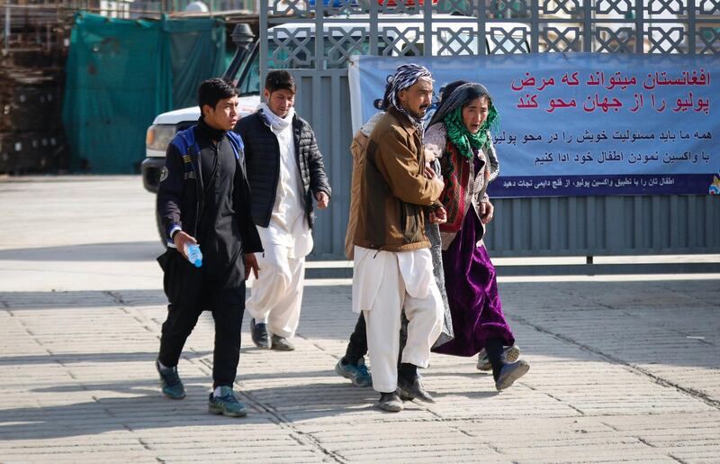 An Afghan woman who lost her family member reacts as she visits the hospital after she gunmen attacked a political gathering in Kabul, Afghanistan.  EPA