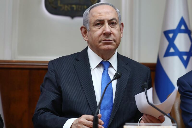 (FILES) In this file photo taken on February 16, 2020 Israeli Prime Minister Benjamin Netanyahu chairs his weekly cabinet meeting in Jerusalem on February 16, 2020. The trial of Israeli Prime Minister Benjamin Netanyahu on corruption charges will open on March 17, the justice ministry said on February 18, 2020. It said the indictment would be read by judge Rivka Friedman-Feldman in the presence of Netanyahu in Jerusalem. The announcement comes as the 70-year-old prime minister campaigns ahead of March 2 elections, Israel's third in less than a year, after two previous polls resulted in a deadlock between Netanyahu and his rival Benny Gantz.
 / AFP / POOL / GALI TIBBON
