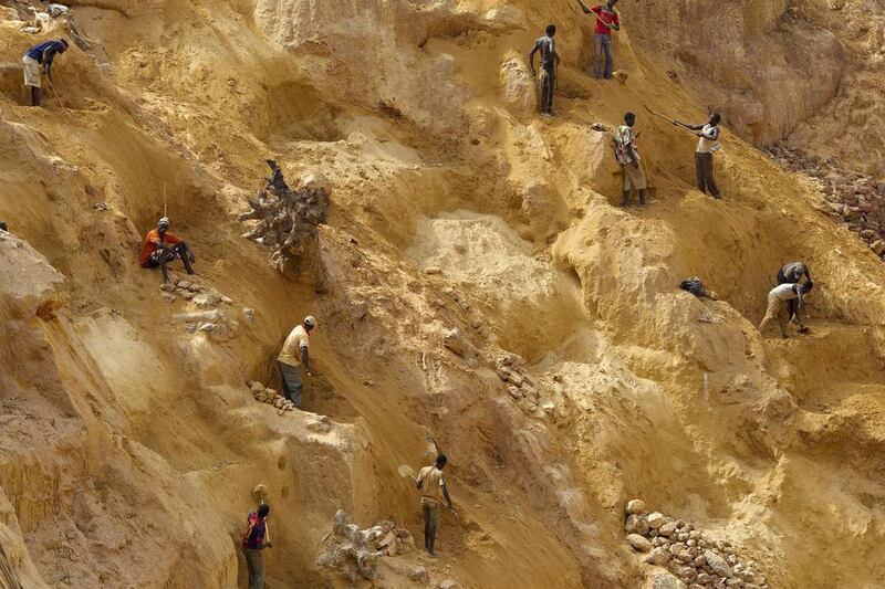 Prospectors work at an open-pit at the Ndassima gold mine. Siegfried Modola / Reuters