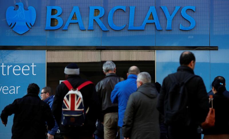 FILE PHOTO: Customers queue outside a branch of Barclays bank in Manchester northern England, March 17, 2016. REUTERS/Phil Noble/File Photo