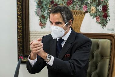 International Atomic Energy Agency director general Rafael Grossi gestures as he wears a mask during a meeting with head of Iran's Atomic Energy Organisation, Ali Akbar Salehi, in Tehran. Image: Reuters