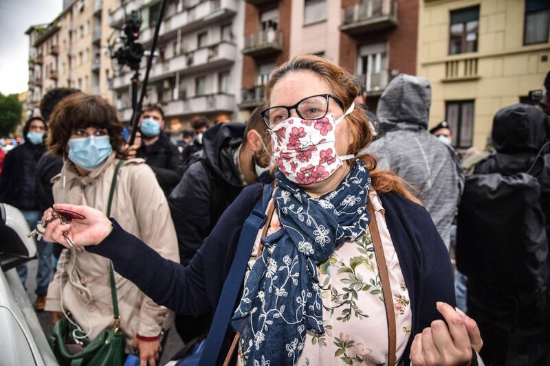 Italian aid worker Silvia Romano's mother Francesca Fumagalli reacts upon her daughter's arrival at home in Milan, Italy.  EPA