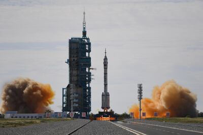 A Long March-2F carrier rocket, carrying the Shenzhou-12 spacecraft and a crew of three astronauts, lifts off from the Jiuquan Satellite Launch Centre in the Gobi desert in northwest China on June 17, 2021, the first crewed mission to China's new space station.  / AFP / GREG BAKER
