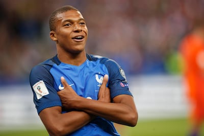 France's Kylian Mbappe reacts after scoring France' s fourth goal during the World Cup Group A qualifying soccer match between France and The Netherlands at the Stade de France stadium in Saint-Denis, outside Paris, Thursday, Aug.31, 2017. (AP Photo/Christophe Ena)