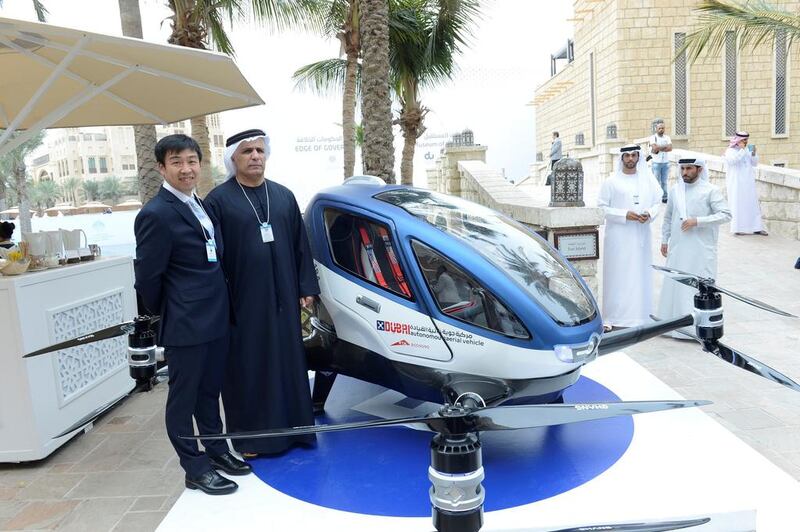 The Dubai RTA chief  Mattar Al Tayer with a representative of the Chinese driverless flying car, or AAV, maker Ehang. “We are working hard to start operation of the AAV this July,” said Mr Al Tayyer. Courtesy APCO Worldwide