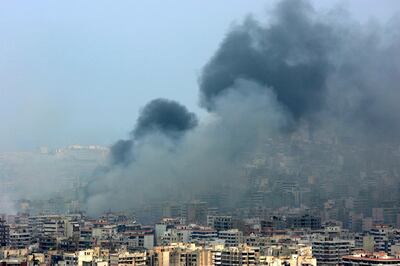 Black smoke rises from the demolished headquarters of Hezbollah in the suburbs of Beirut following Israeli air strikes in July 2006. AP Photo