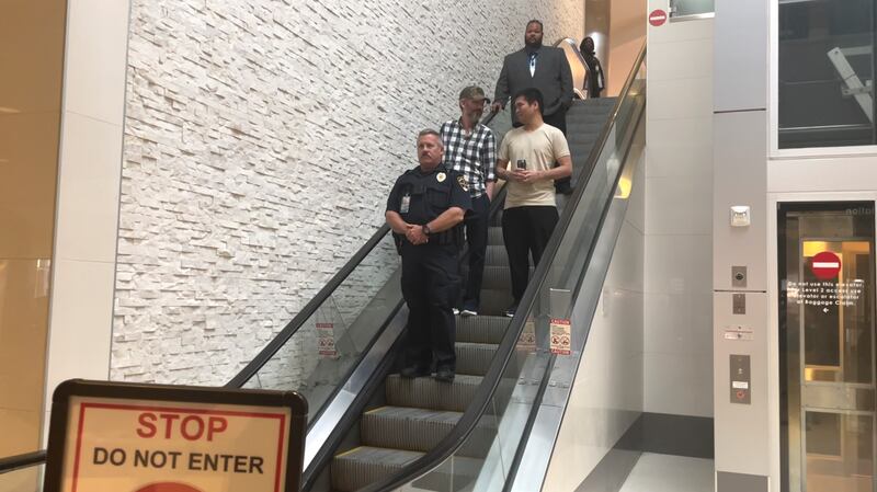 Andy Huynh, pale T-shirt, and Alex Drueke, checked shirt, arriving at Birmingham-Shuttlesworth International Airport in Birmingham, Alabama. AP