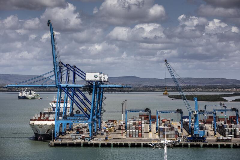 A ship-to-shore crane loads containers onto a ship at Mombasa port, operated by Kenya Ports Authority, in Mombasa, Kenya, on Saturday, Sept. 1, 2018. China's modern-day adaptation of the Silk Road, known as the Belt and Road Initiative, aims to revive and extend trading routes connecting China with Central Asia, the Middle East, Africa and Europe via networks of upgraded or new railways, ports, pipelines, power grids and highways. Photographer: Luis Tato/Bloomberg