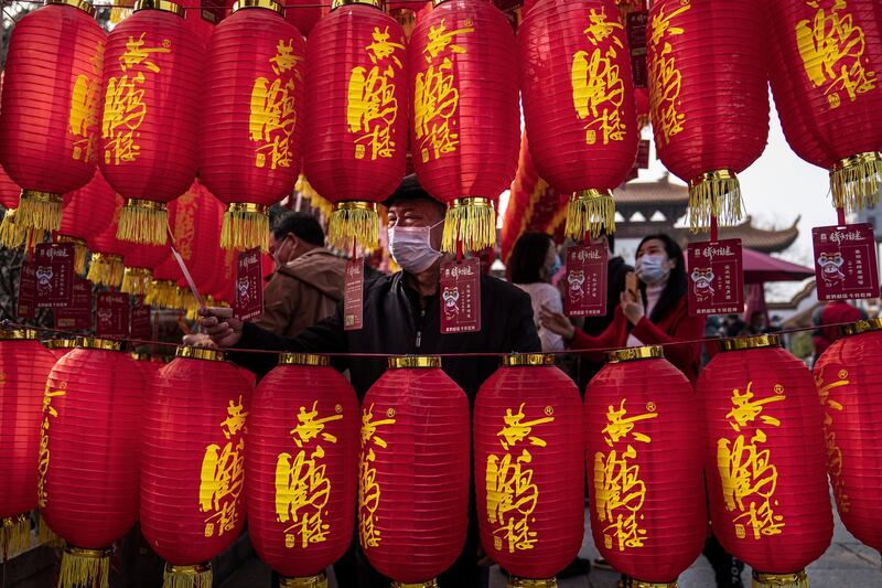 People look at the riddles written on lanterns during the first day of the Spring Festival at the Yellow Crane Tower Par in Wuhan, Hubei Province, China. Getty Images