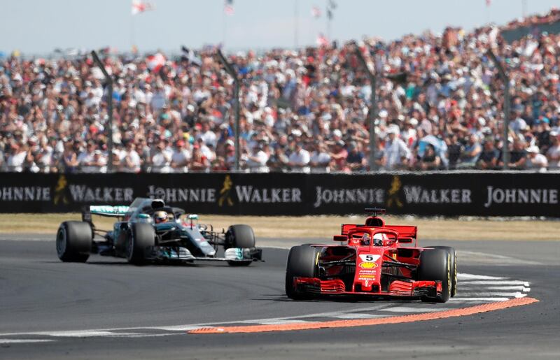 Formula One F1 - British Grand Prix - Silverstone Circuit, Silverstone, Britain - July 8, 2018   Ferrari's Sebastian Vettel leads Mercedes' Lewis Hamilton during the race   Action Images via Reuters/Matthew Childs