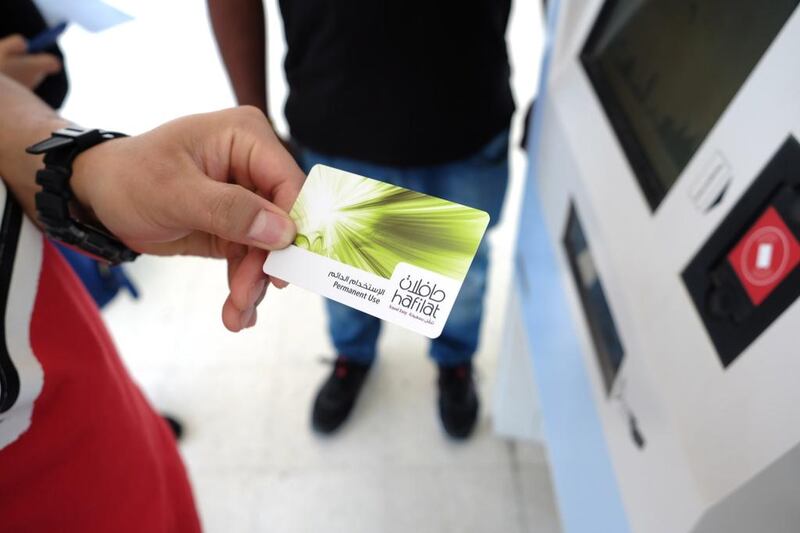 The new Abu Dhabi bus system’s smart card, Hafilat, rolled out on May 15, 2015, with bus riders now able to purchase the smart card for monthly use or a reloadable card with various amounts. Special cards for seniors, students and those with special needs are also available. Delores Johnson / The National