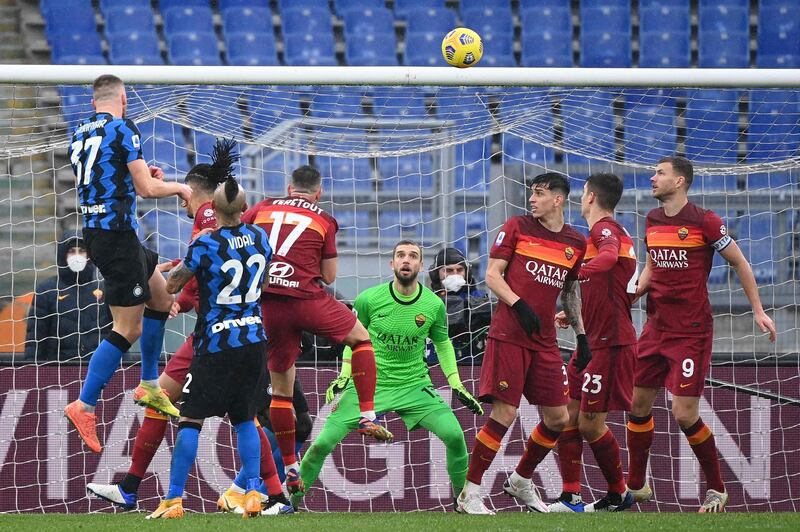 Inter defender Milan Skriniar heads home their first goal. AFP