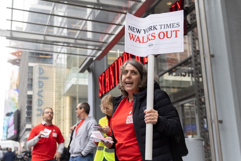 People picket in front of the New York Times building in Manhattan. Reuters