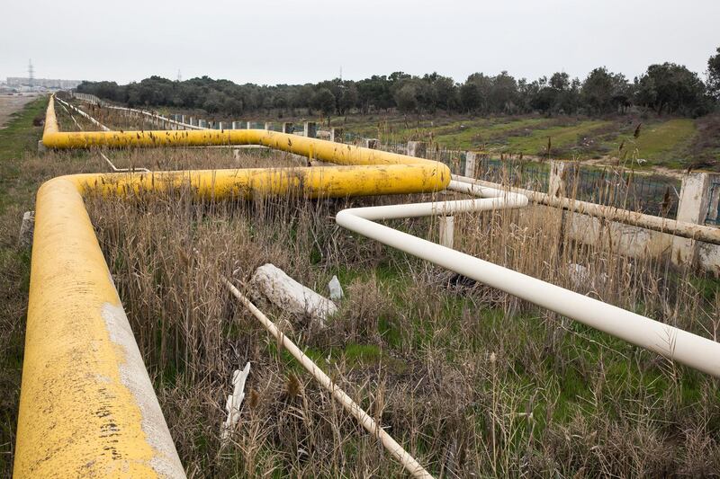 An oil pipeline runs beside a road in Baku, Azerbaijan, on Sunday, March 18, 2018. Two years after descending into junk, Azerbaijan's shortest path to winning back its investment grade is by rebuilding the stash of petrodollars it raided during a recession and a banking meltdown, according to Fitch Ratings. Photograph: Taylor Weidman/Bloomberg