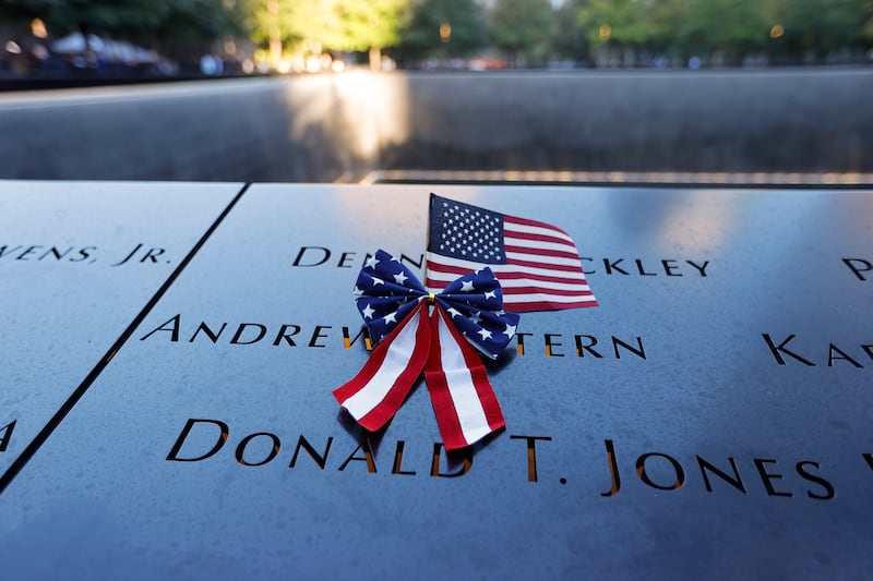 A U. S.  flag is seen on the 9/11 Memorial on the 20th anniversary of the September 11 attacks in Manhattan, New York City, U. S. EPA