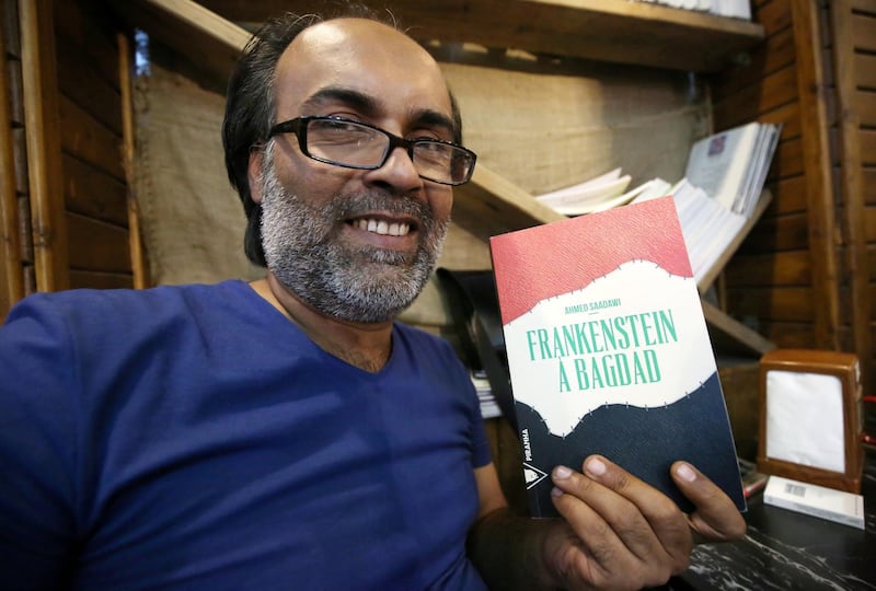 Iraqi writer, Ahmed Saadawi poses with his book titled in French "Frankenstein a Bagdad" (Frankenstein in Baghdad) on August 4, 2016 in the capital Baghdad.
When Ahmed Saadawi finished writing "Frankenstein in Baghdad", a dark fantasy about the war that tore Iraq apart a decade ago, he thought his novel dealt with the past. But just like the monster Mary Shelley first dreamt up exactly 200 years ago, Saadawi's hero took on a life of its own. Saadawi won the International Prize for Arabic Fiction in 2014 and became one of the new stars of the regional literary world.


 / AFP PHOTO / AHMAD AL-RUBAYE / TO GO WITH AFP STORY BY JEAN-MARC MOJON