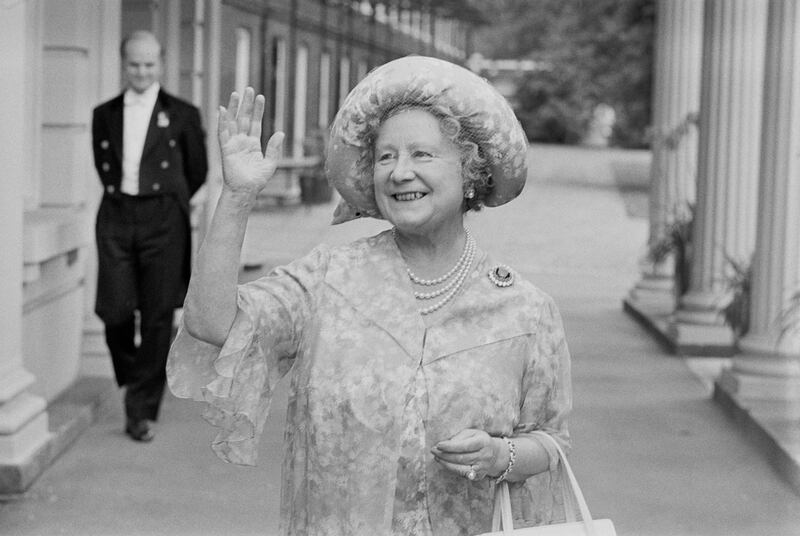 Queen Elizabeth, the Queen Mother (1900 - 2002), waves to the crowd who have gathered outside Clarence House, her London home, to wish her a happy 78th birthday, UK, 4th August 1978. (Photo by Evening Standard/Getty Images)