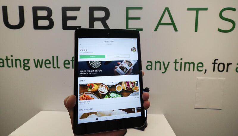 epa06134917 Uber Technologies' food delivery mobile app UberEATS, is displayed on a tablet after the American company debuted the service in Seoul, South Korea, 10 August 2017.  EPA/YONHAP SOUTH KOREA OUT