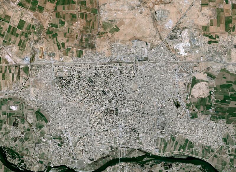 This handout image released by Airbus DS and taken by Pleiades satellites on March 11, 2017, shows the Syrian city of Raqa, Islamic State (IS) group's de facto capital. (Photo by HO / various sources / AFP) / RESTRICTED TO EDITORIAL USE - MANDATORY CREDIT "AFP PHOTO / CNES 2017 / DISTRIBUTION AIRBUS DS" - NO MARKETING NO ADVERTISING CAMPAIGNS - DISTRIBUTED AS A SERVICE TO CLIENTS