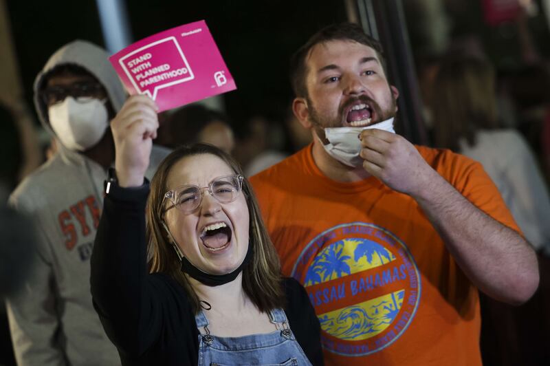 A protester holds a sign for the pro-choice Planned Parenthood organisation. AFP