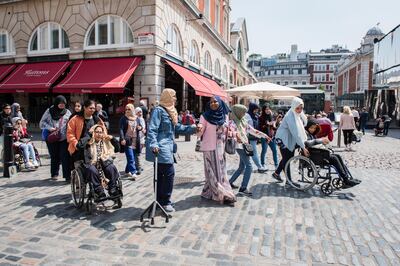 London, UK-- May 27, 2016 -- Staff and disabled students from Zayed University in Dubai visiting London, part of a week long visit looking at disabled provision in Higher Education in the UK.  Covent Garden, London. For news story by Joseph Lee.  (Eleanor Bentall for The National) *** Local Caption ***  Zayed_University_0025.jpg