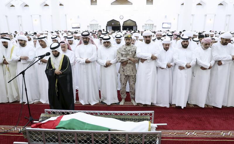 Sheikh Ammar bin Humaid Al Nuaimi, Crown Prince of Ajman, leads prayers for Warrant Officer Sameer Mohammed Murad Abu Bakr, who was killed in a helicopter crash on Friday in Yemen. Wam
