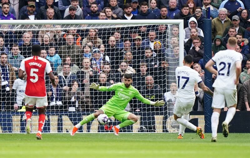 Tottenham Hotspur's Cristian Romero beats Arsenal goalkeeper David Raya to score their first goal. PA 