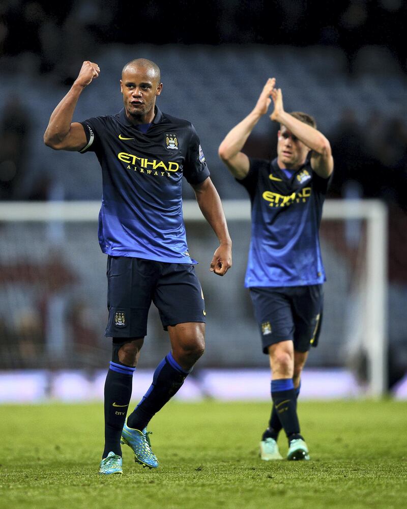 BIRMINGHAM, ENGLAND - OCTOBER 04:  Vincent Kompany and James Milner of Manchester City celebrate victory after the Barclays Premier League match between Aston Villa and Manchester City at Villa Park on October 4, 2014 in Birmingham, England.  (Photo by Ian Walton/Getty Images)