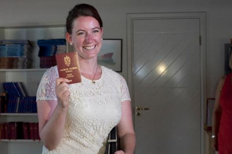 Dubai, United Arab Emirates - July 22 2013 -  Marte Dalelv walks into the Norwegian Seaman's Center displaying her passport to the press. The center, located in Bur Dubai, became her safe haven during the course of her trial and initial sentencing. She is now a free woman after being granted a full pardon from the Prosecutor's Office. For Story by Ramola Tawar.   (Razan Alzayani / The National)