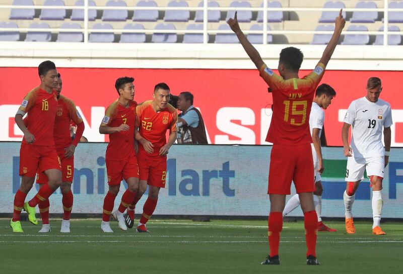 China's players celebrate after scoring their equaliser. AFP