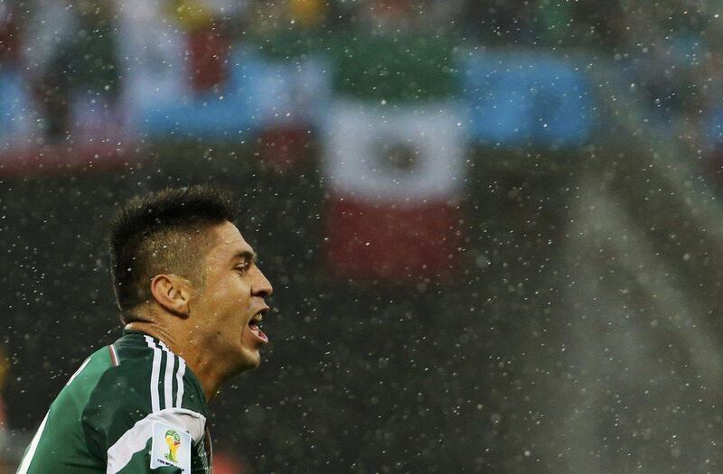 Oribe Peralta celebrates his goal for Mexico on Friday against Cameroon at the 2014 World Cup in Natal, Brazil. Jorge Silva / Reuters