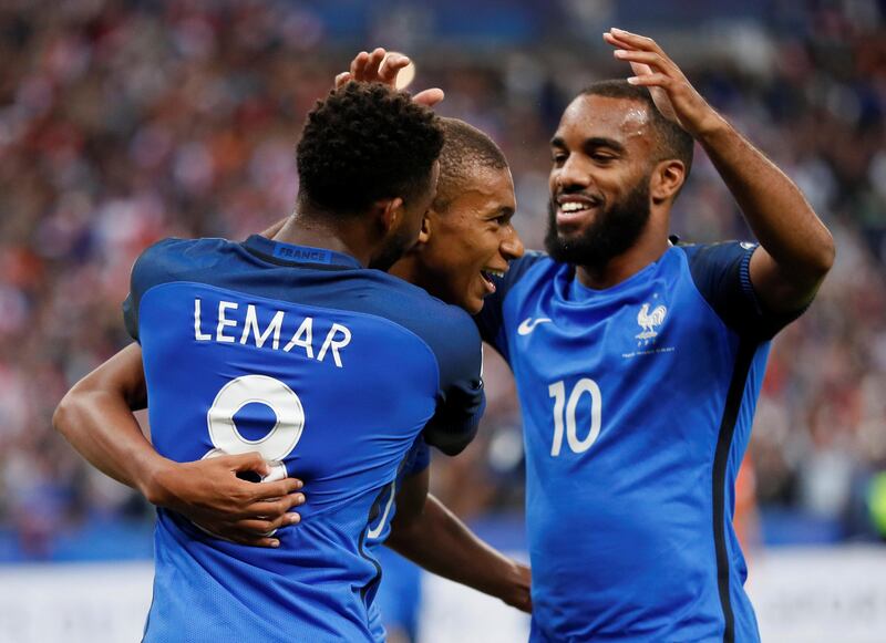 Soccer Football - 2018 World Cup Qualifications - Europe - France vs Netherlands - Saint-Denis, France - August 31, 2017   France's Kylian Mbappe celebrates scoring their fourth goal with Thomas Lemar and Alexandre Lacazette    REUTERS/Gonzalo Fuentes