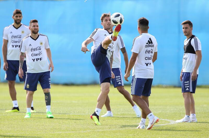 Lucas Biglia of Argentina and teammates warm up during a training session. Gabriel Rossi / Getty Images