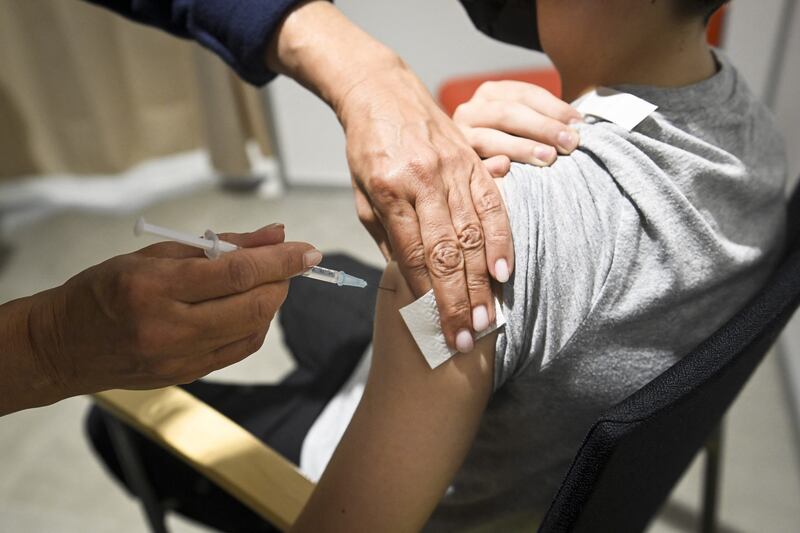 A 12-year-old boy receives a dose of the Pfizer-BioNtech Covid-19 vaccine in Espoo, Finland. AFP