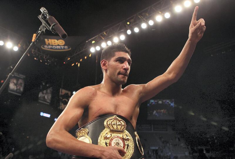 LAS VEGAS - DECEMBER 11:  Amir Khan of England celebrates after his unanimous decision victory against Marcos Maidana of Argentina after their WBA super lightweight title fight at Mandalay Bay Events Center on December 11, 2010 in Las Vegas, Nevada.  (Photo by Scott Heavey/Getty Images)