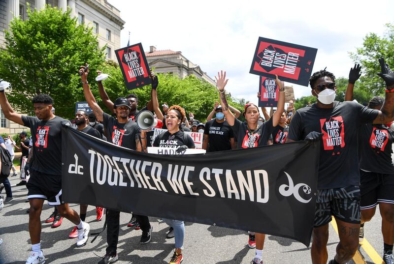 People participate in a 'Together We Stand' march in commemoration of Juneteenth in Washington, DC. EPA