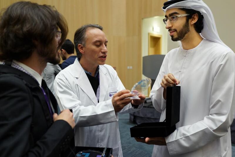 Khalid Alawar (right) chats after his hack team,Teslam, won the audience award at the NYUAD Hackathon for social good in the Arab World in Abu Dhabi.  Delores Johnson /  The National / April 16, 2017