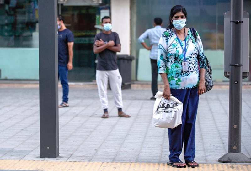 Abu Dhabi, United Arab Emirates, July 10, 2020.   
  Abu Dhabi residents exercising on a Friday morning.  Abu Dhabi residents waiting for their bus on a Friday morning.
Victor Besa  / The National
Section:  Standalone
Reporter: