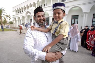 Abu Dhabi, United Arab Emirates, August 11, 2019. Eid prayers at Zayed The 2nd Mosque. Miran Omar and son Mohammed after Eid prayers. Victor Besa/The National Section: NA Reporter: Haneen Dajani