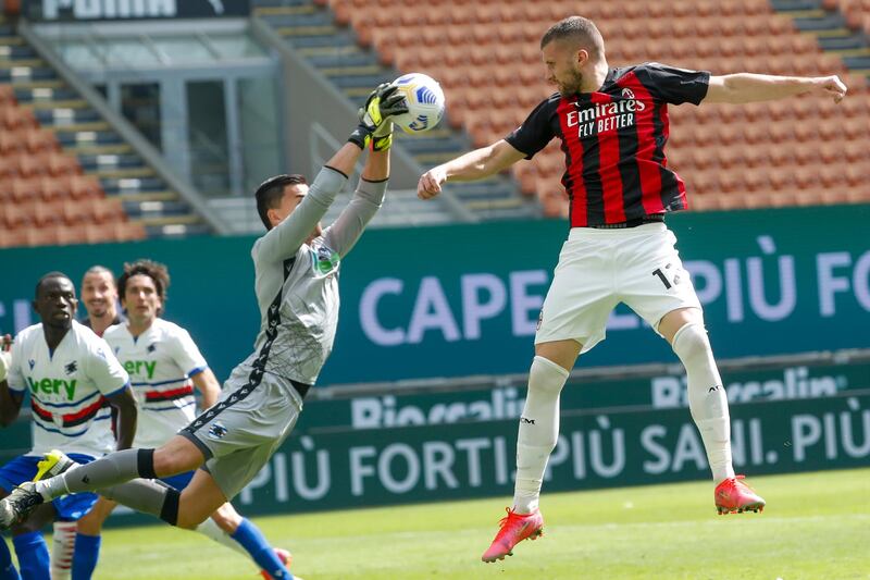 Sampdoria's goalkeeper Emil Audero, left, saves against AC Milan's Ante Rebic. AP